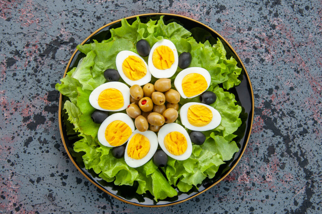 top view tasty egg salad consists green salad olives light background